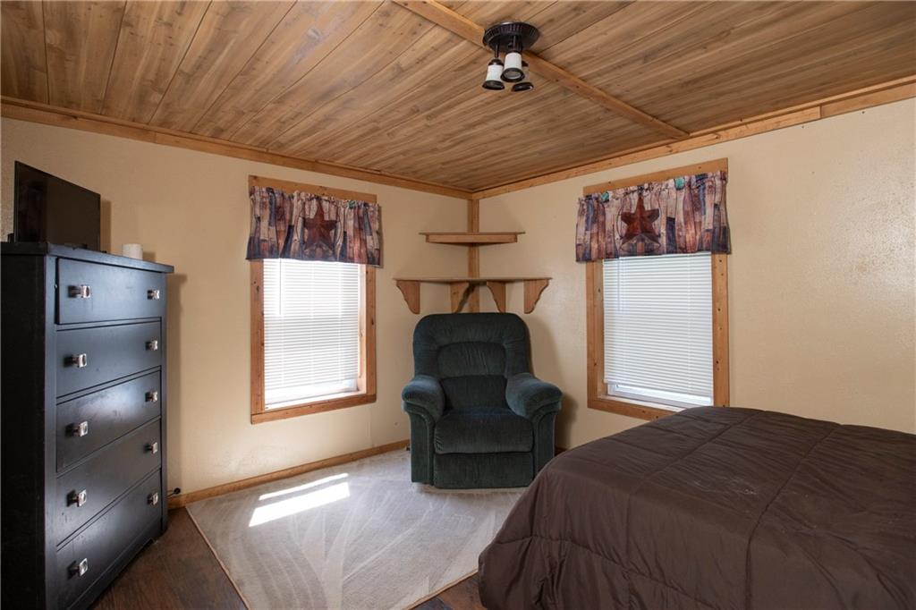 9133 South Watson Run Road Meadville, PA 16335 - Photo 22 of 45 a bedroom with a bed and a chandelier