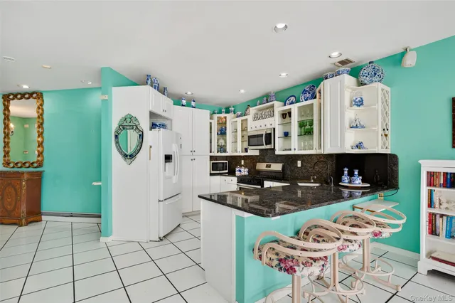 a bath tub sitting next to a window