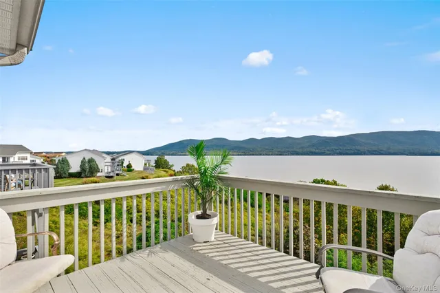 a bedroom with a bed and a tv on dresser