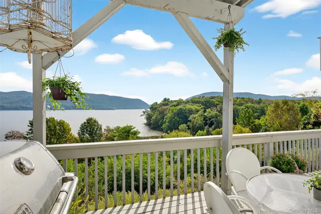 a dining room with furniture a chandelier and window