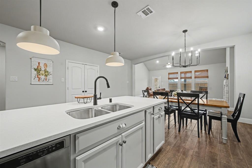 433 Forestridge Drive Fate, TX 75087 - Photo 16 of 38 a kitchen with sink and cabinets