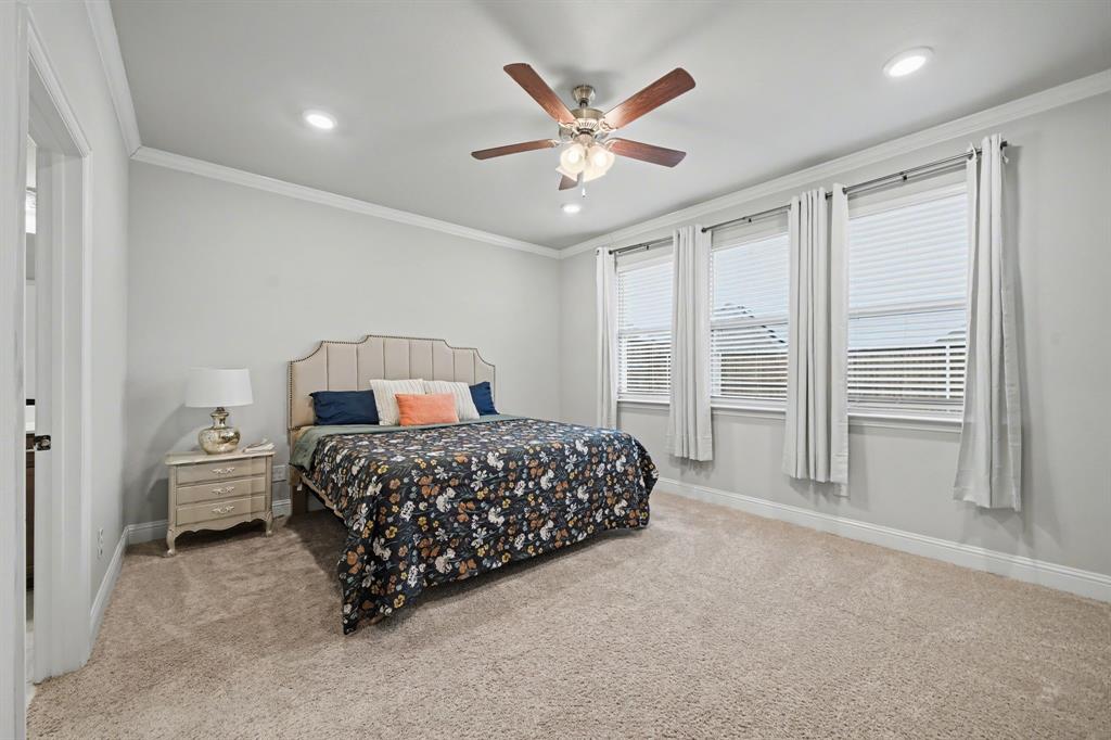 433 Forestridge Drive Fate, TX 75087 - Photo 18 of 38 a bedroom with a bed and window