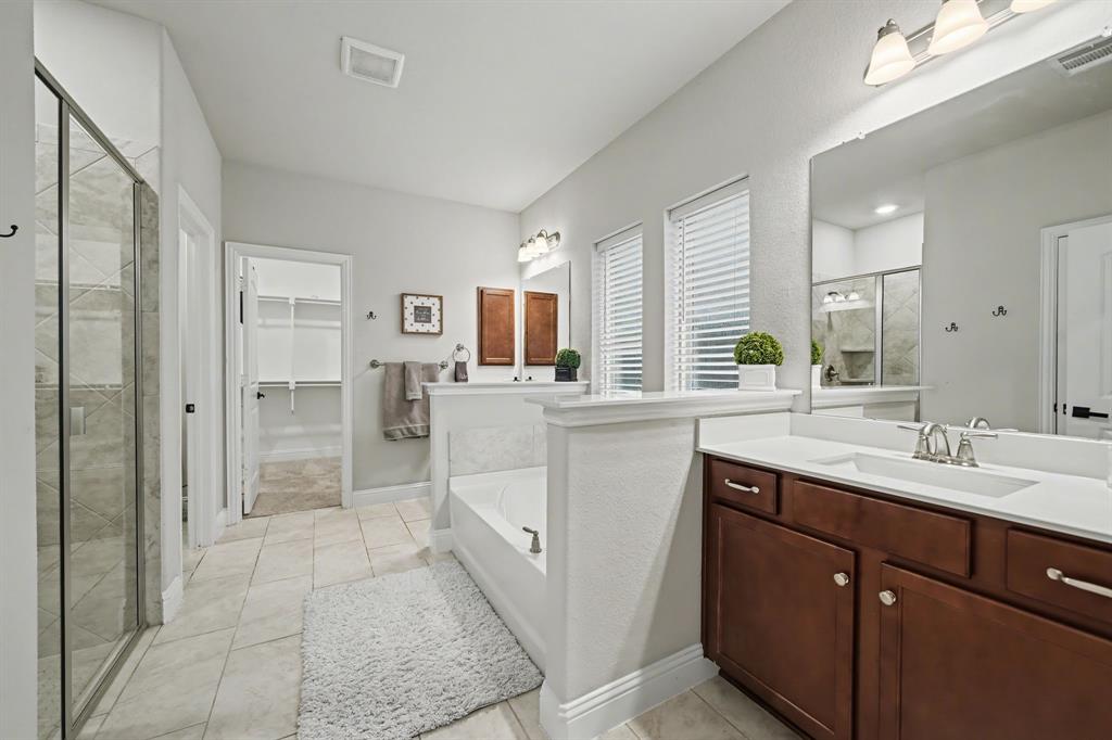 433 Forestridge Drive Fate, TX 75087 - Photo 20 of 38 a kitchen with a sink and cabinets
