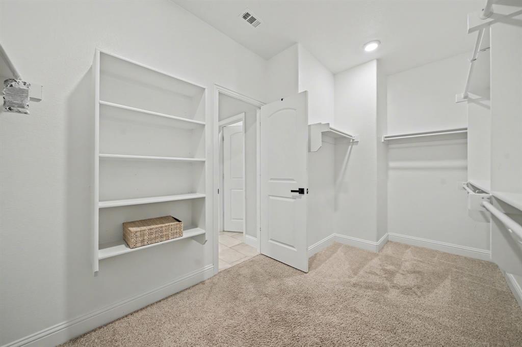 433 Forestridge Drive Fate, TX 75087 - Photo 22 of 38 a view of an empty room with a closet
