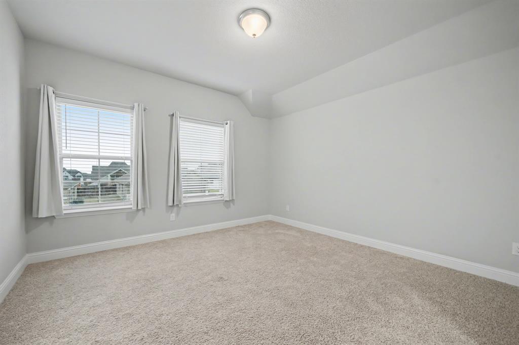433 Forestridge Drive Fate, TX 75087 - Photo 30 of 38 an empty room with windows