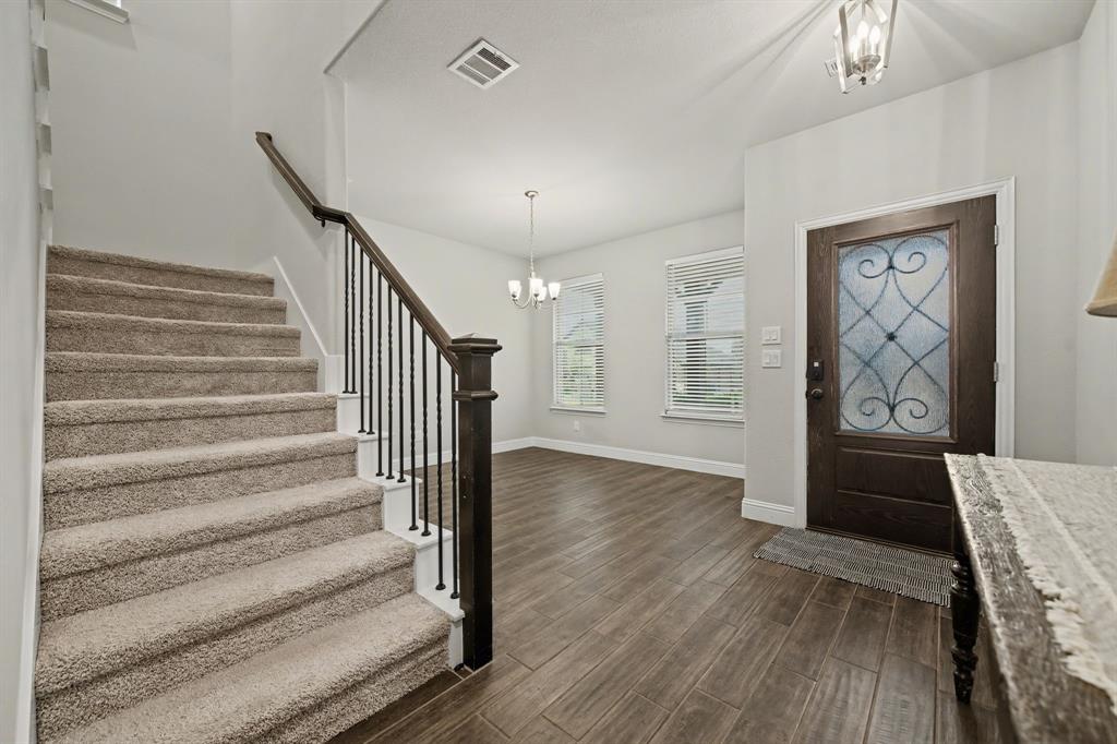 433 Forestridge Drive Fate, TX 75087 - Photo 4 of 38 a view of an entryway with wooden floor