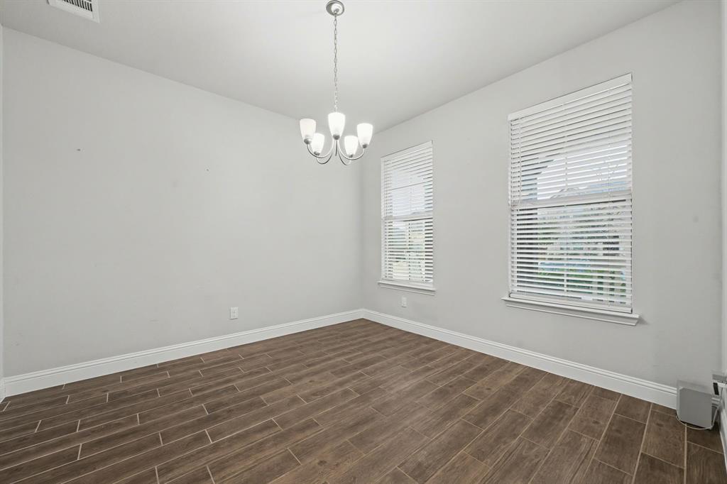 433 Forestridge Drive Fate, TX 75087 - Photo 5 of 38 a view of empty room with wooden floor and window