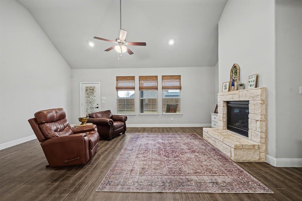 433 Forestridge Drive Fate, TX 75087 - Photo 8 of 38 a living room with furniture and a fireplace