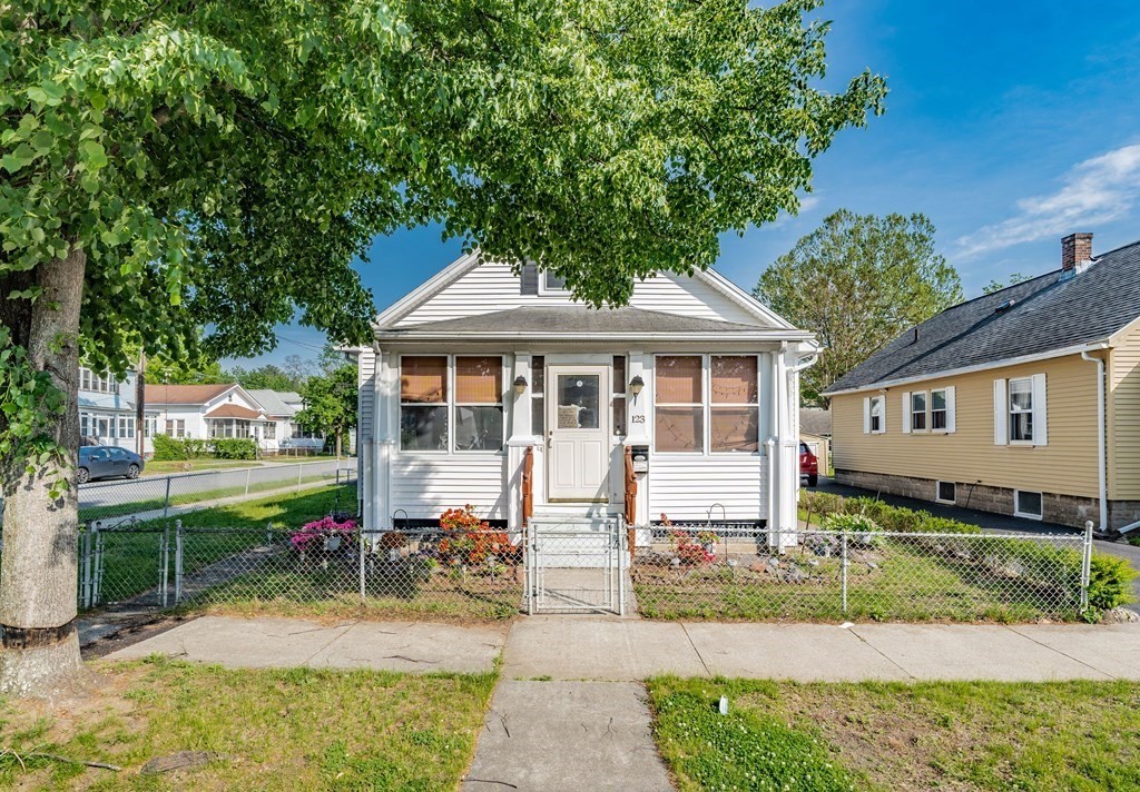 123 Wilber Street Springfield, MA 01104 - Photo 1 of 27 a front view of a house with garden