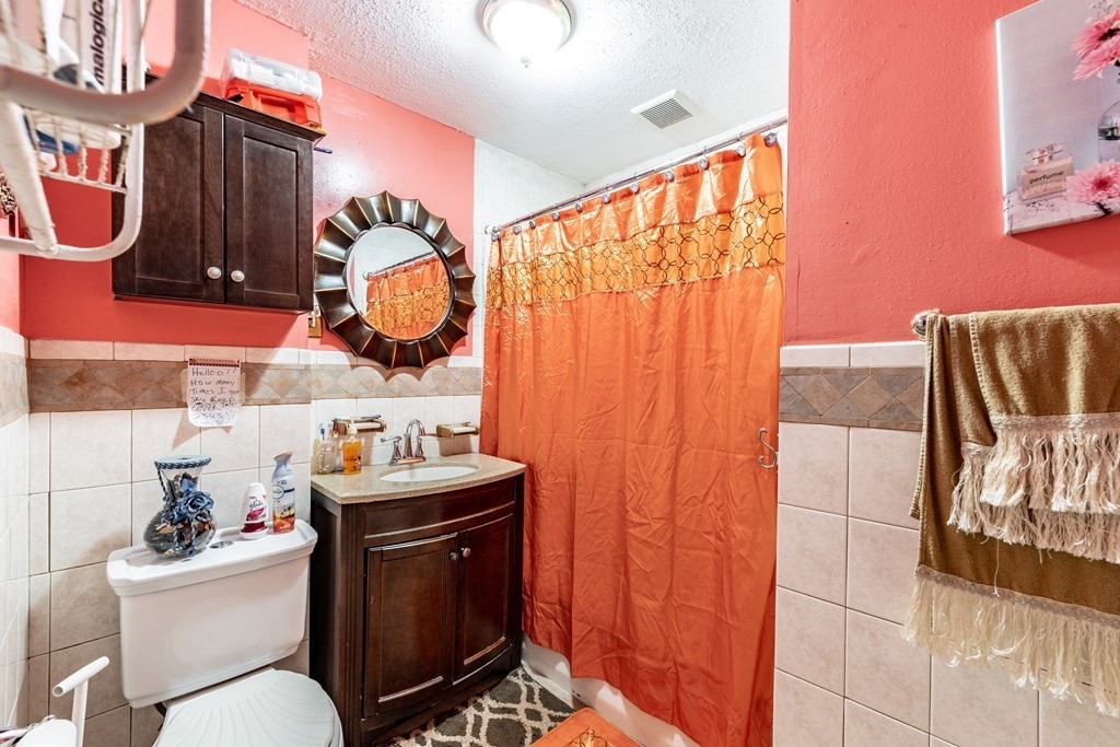 123 Wilber Street Springfield, MA 01104 - Photo 18 of 27 a bathroom with a sink toilet and mirror