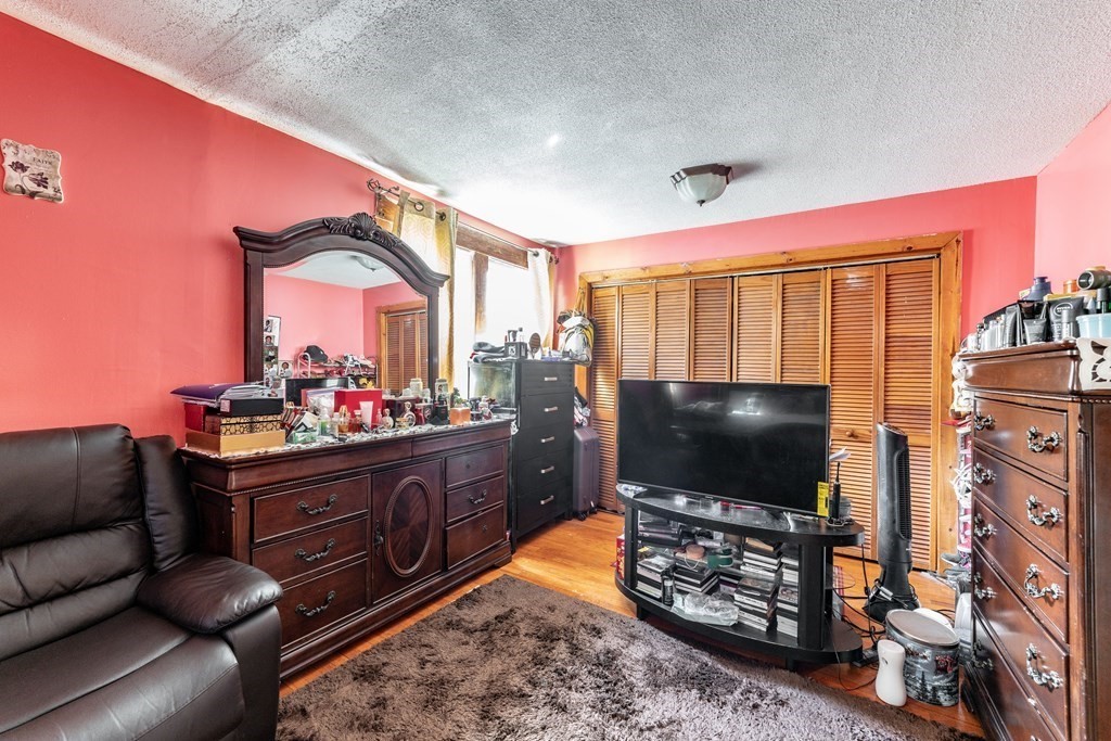 123 Wilber Street Springfield, MA 01104 - Photo 20 of 27 a room with furniture and a flat screen tv
