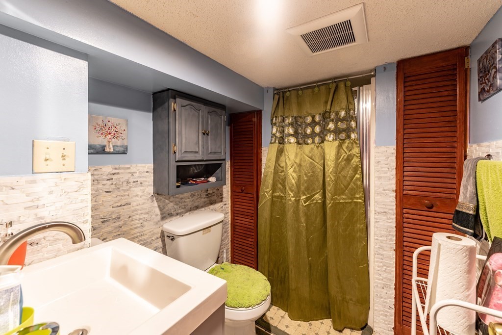 123 Wilber Street Springfield, MA 01104 - Photo 23 of 27 a bathroom with a sink toilet and shower