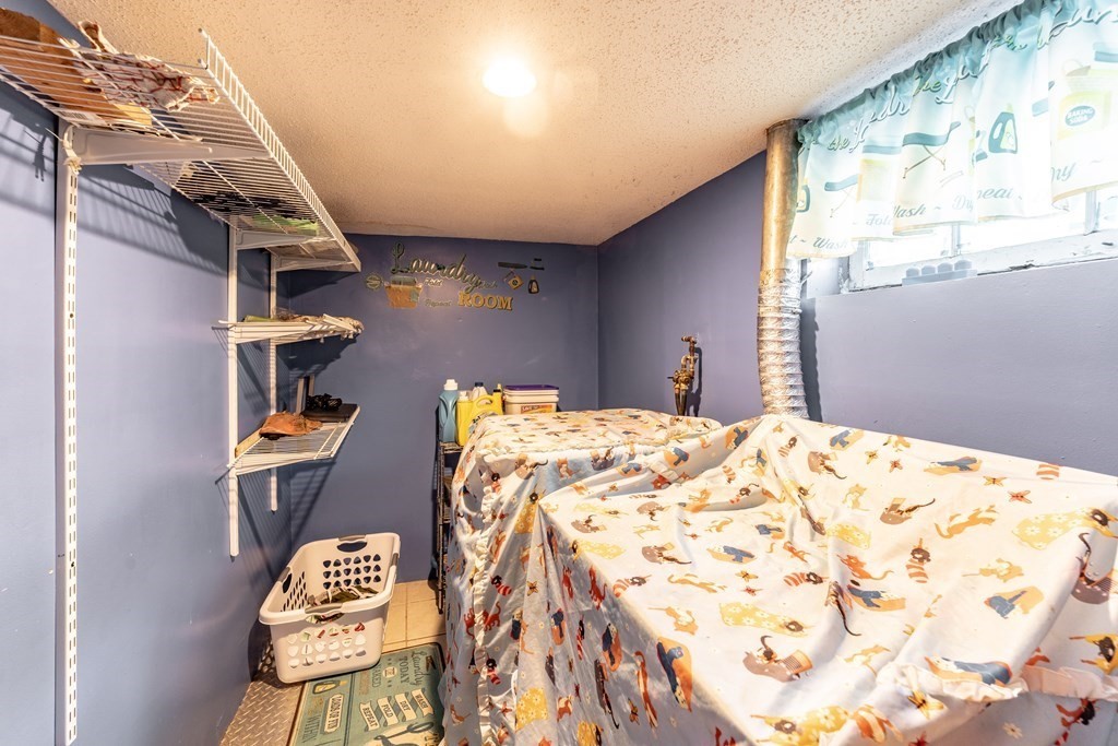 123 Wilber Street Springfield, MA 01104 - Photo 24 of 27 a bed room with a bed