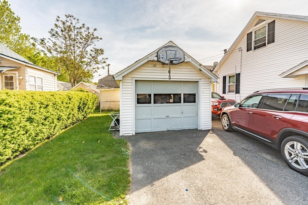 123 Wilber Street Springfield, MA 01104 - Photo 27 of 27 a front view of a house with a yard
