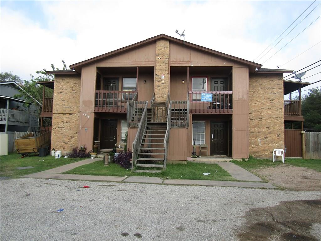 4910 Pepper Lane, Unit D Austin, TX 78744 - Photo 1 of 1 a front view of a house with a yard
