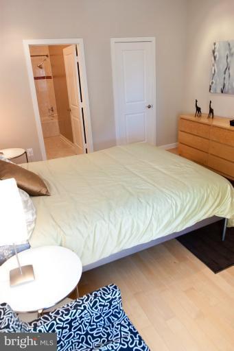 1917 2nd Street Northeast, Unit 201 Washington, DC 20002 - Photo 10 of 23 a bedroom with a bed and a dresser