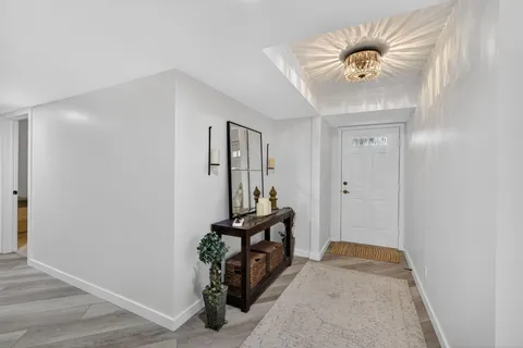 a room with furniture and view of living room