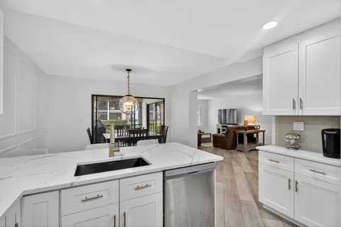 a kitchen with stainless steel appliances refrigerator and cabinets