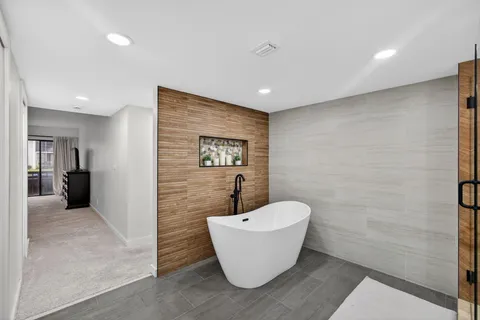 a bathroom with a double sink shower and a mirror