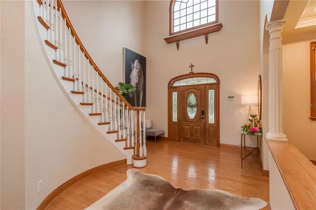 a spacious bathroom with a granite countertop sink mirror and a bathtub