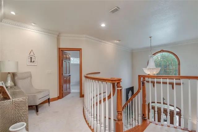 a view of a patio with table and chairs potted plants with floor to ceiling window and garden
