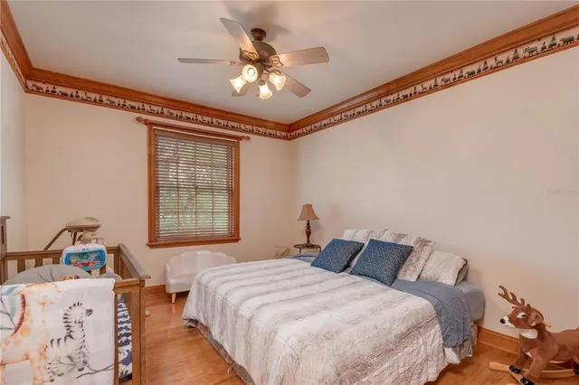 an aerial view of a houses with a yard