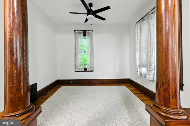 a view of an empty room and a window