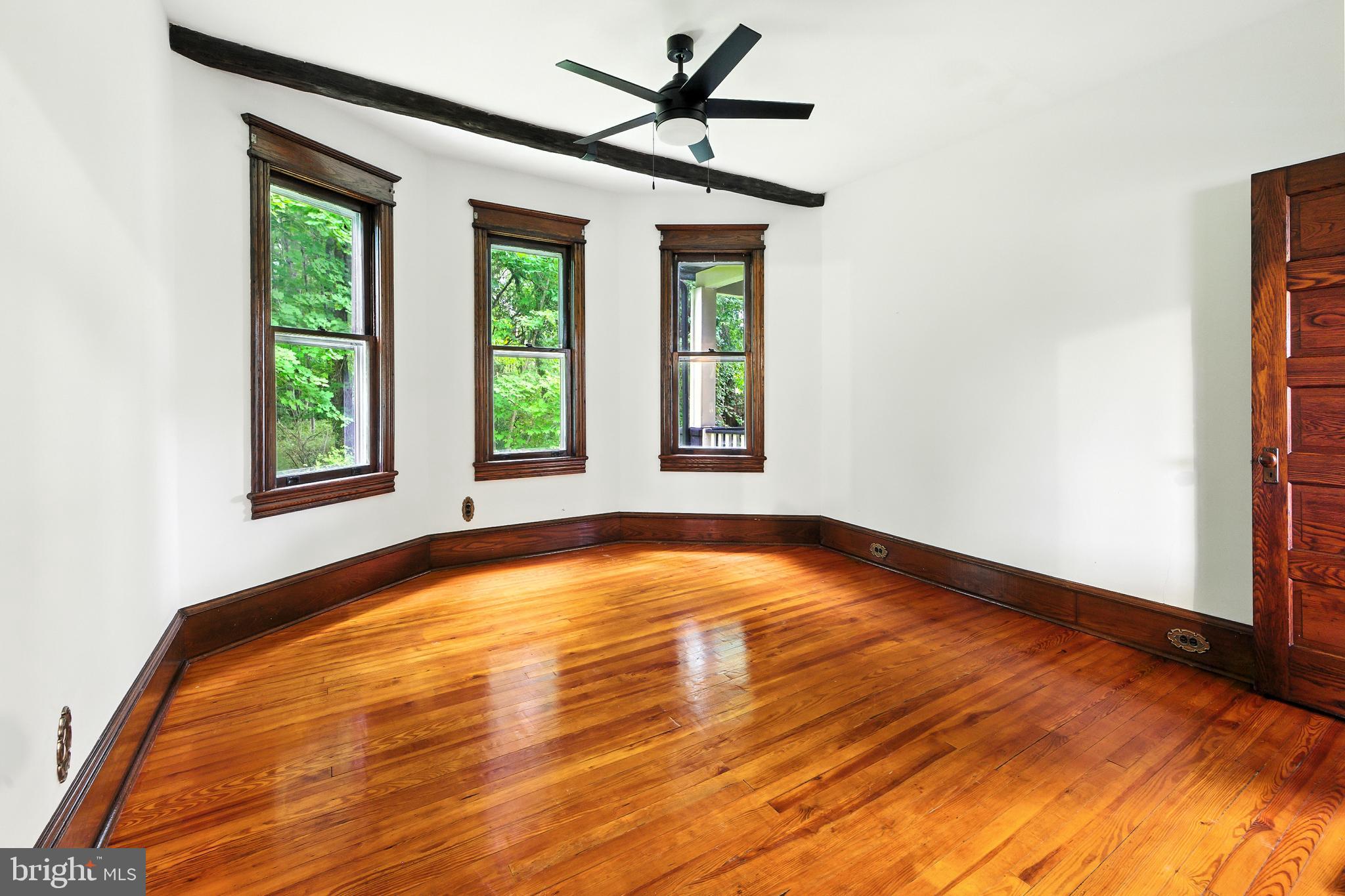 640 Mantua Boulevard Sewell, NJ 08080 - Photo 5 of 25 a view of an empty room with window and chandelier fan
