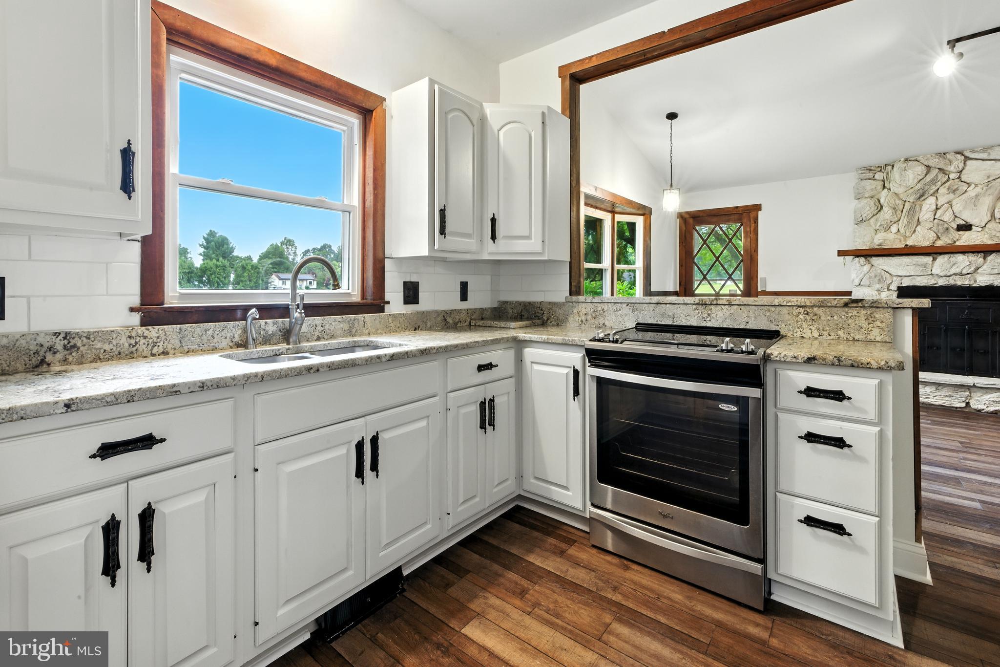 640 Mantua Boulevard Sewell, NJ 08080 - Photo 7 of 25 a kitchen with stainless steel appliances a stove sink and cabinets