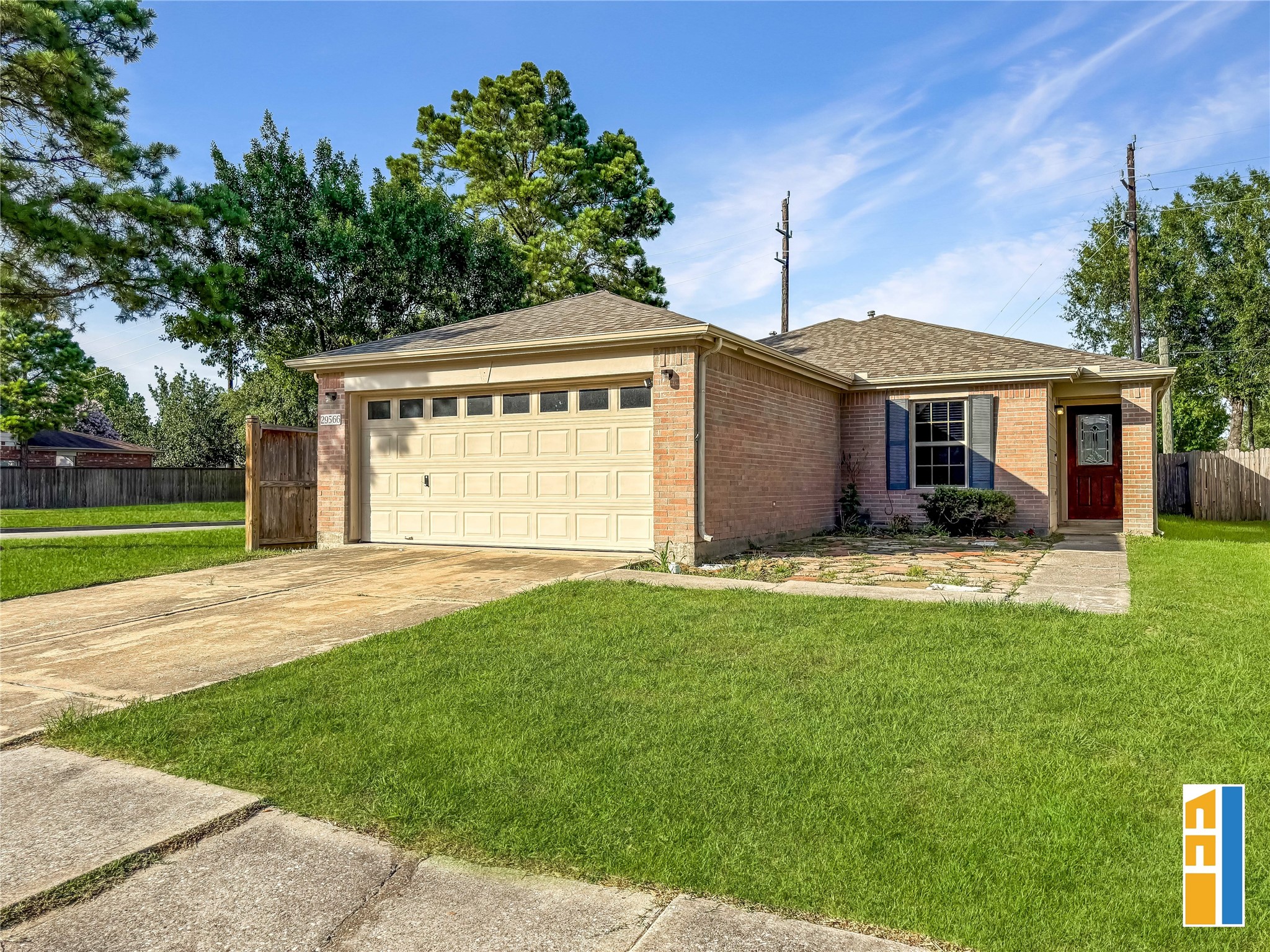 29566 North Legends Bend Drive Spring, TX 77386 - Photo 21 of 21 This charming single-story brick home features a two-car garage and a welcoming front entrance. It is situated on a spacious corner lot with a well-maintained lawn, offering ample outdoor space for landscaping or recreation.