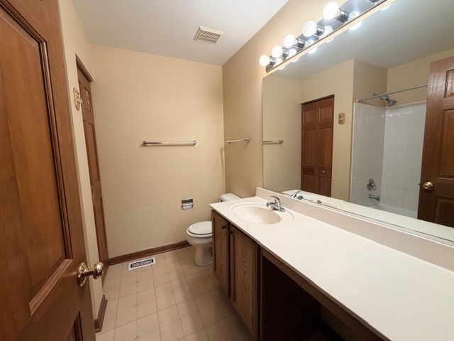 2418 Oneida Lane, Unit 2418 Naperville, IL 60563 - Photo 12 of 21 a bathroom with a sink a toilet a mirror and shower