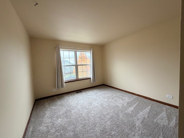 2418 Oneida Lane, Unit 2418 Naperville, IL 60563 - Photo 15 of 21 an empty room with windows