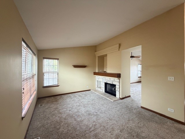 2418 Oneida Lane, Unit 2418 Naperville, IL 60563 - Photo 17 of 21 a view of an empty room with a fireplace and a window