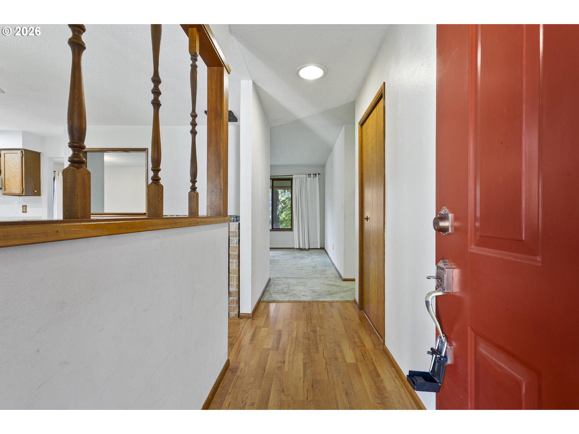 10410 Southwest 25th Avenue Portland, OR 97219 - Photo 17 of 39 a view of a hallway with wooden floor and staircase