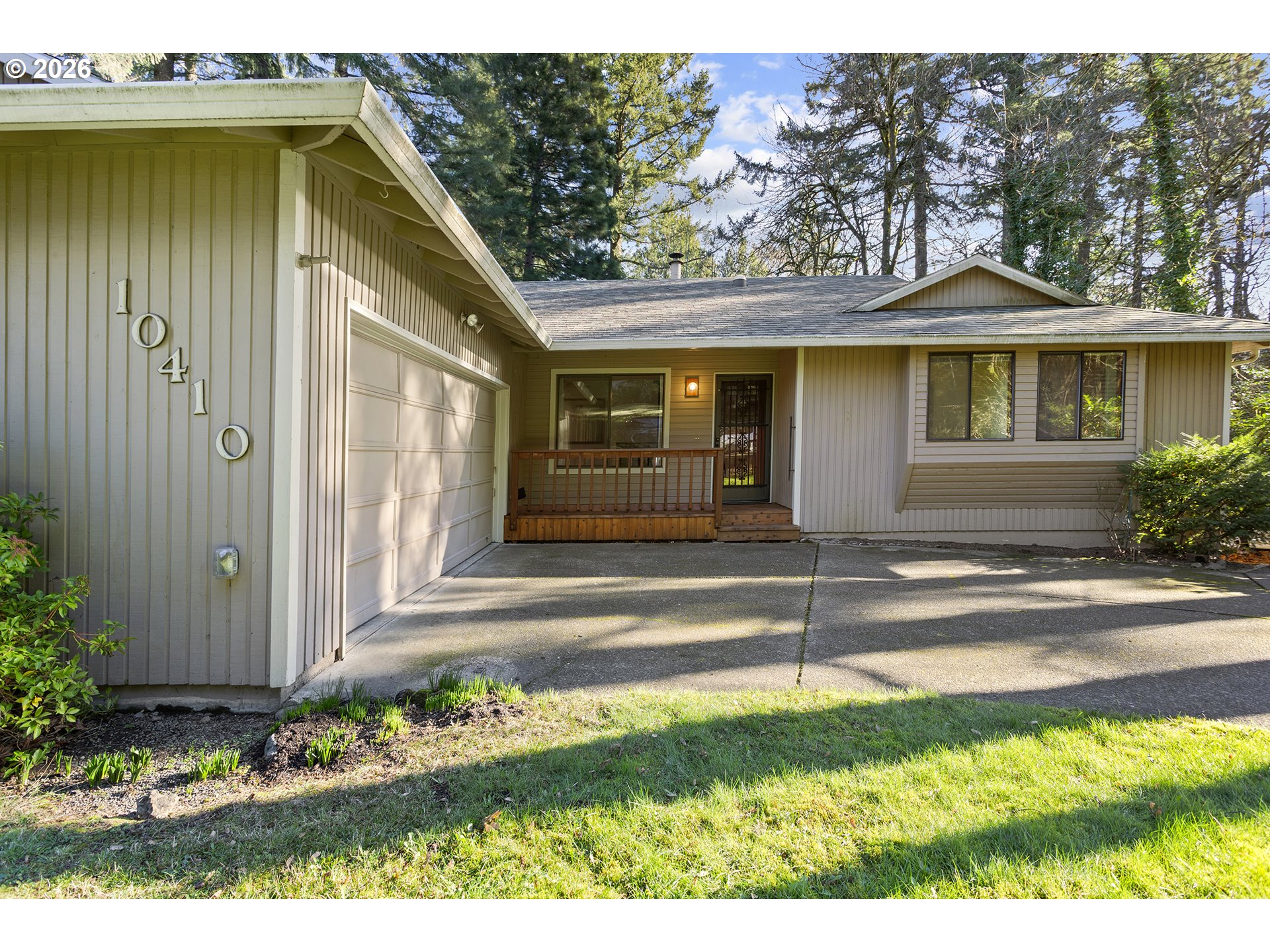 10410 Southwest 25th Avenue Portland, OR 97219 - Photo 2 of 39 a view of a house with a yard