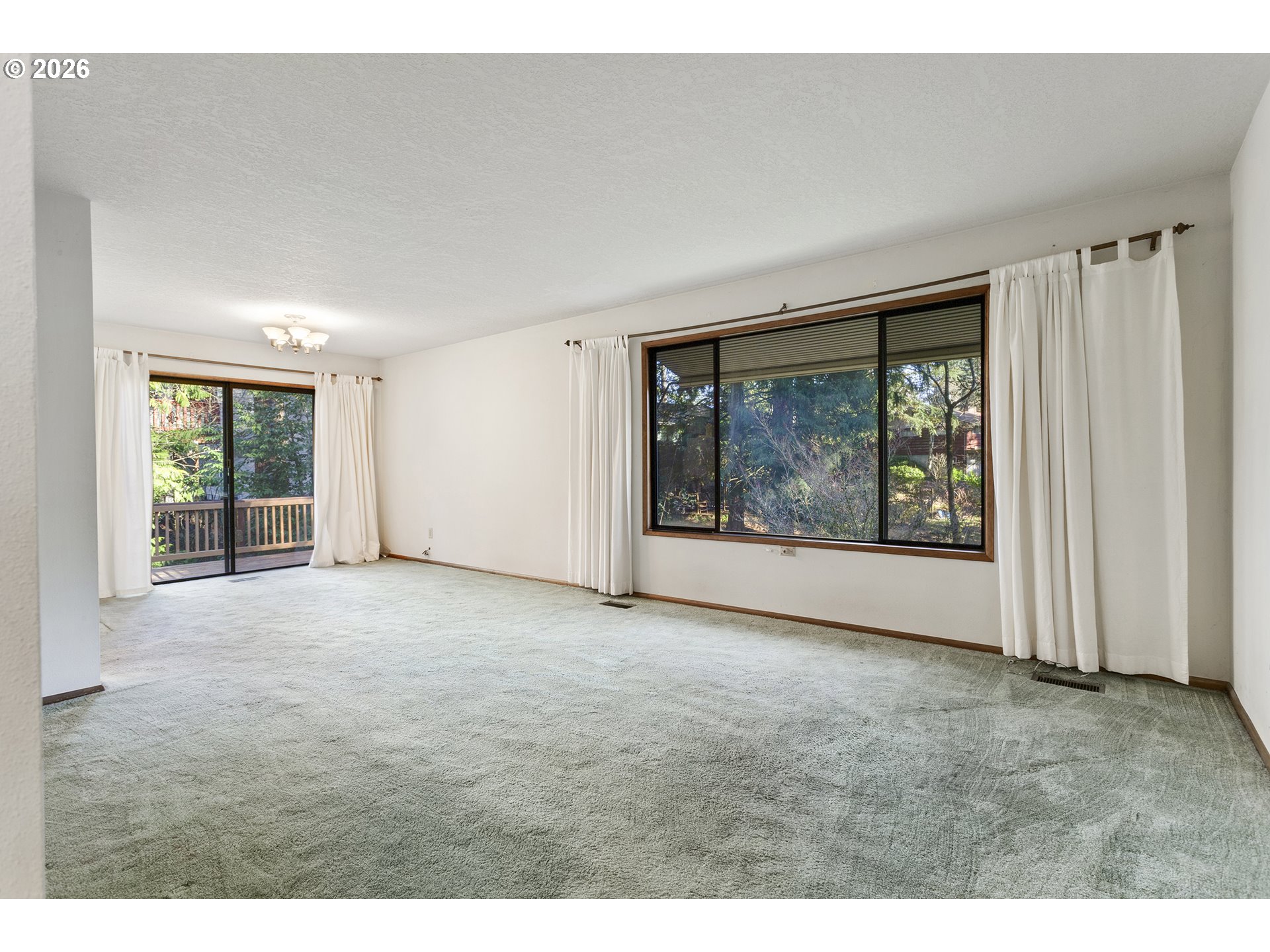 10410 Southwest 25th Avenue Portland, OR 97219 - Photo 22 of 39 a view of an empty room with a window