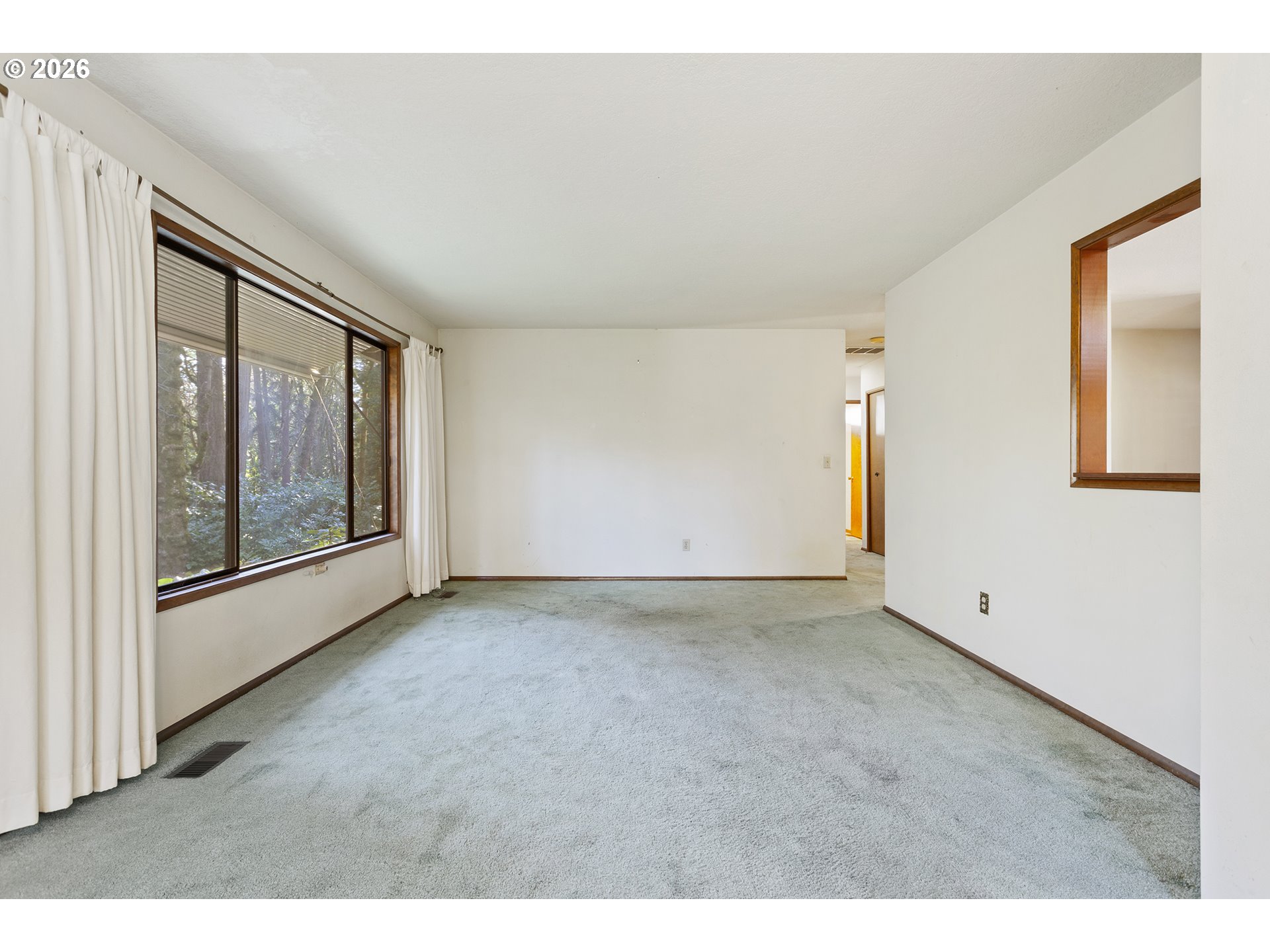 10410 Southwest 25th Avenue Portland, OR 97219 - Photo 25 of 39 a view of an empty room with window