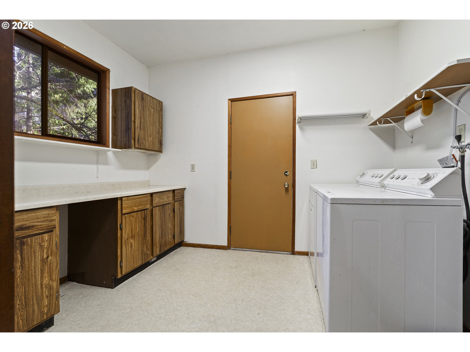 10410 Southwest 25th Avenue Portland, OR 97219 - Photo 28 of 39 a utility room with closet dryer and washer