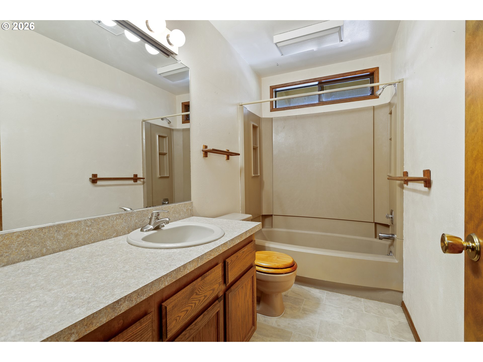 10410 Southwest 25th Avenue Portland, OR 97219 - Photo 34 of 39 a bathroom with a granite countertop sink toilet and shower