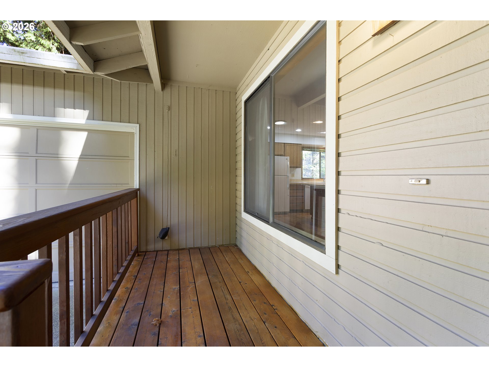 10410 Southwest 25th Avenue Portland, OR 97219 - Photo 4 of 39 a view of balcony with wooden floor