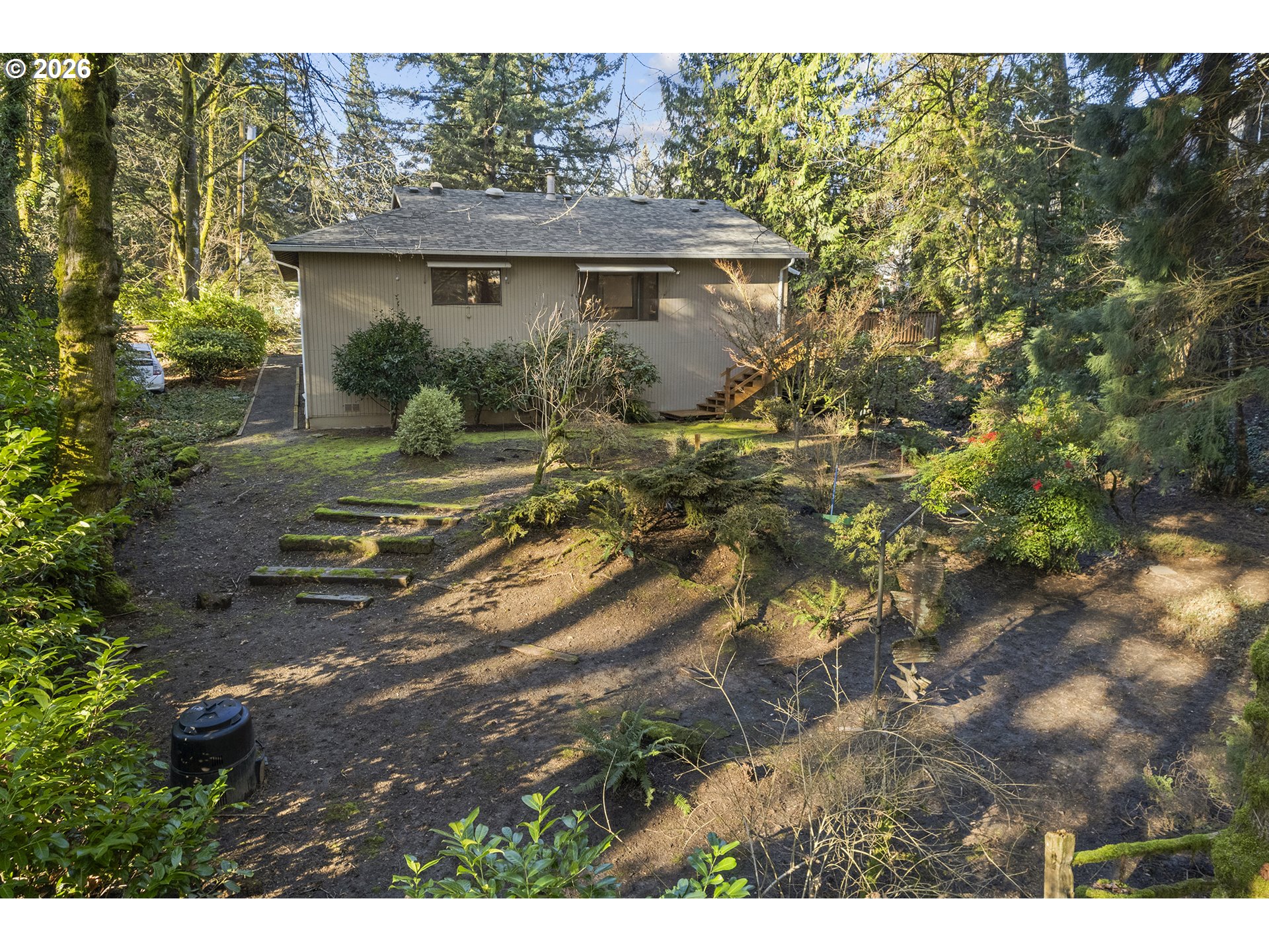 10410 Southwest 25th Avenue Portland, OR 97219 - Photo 7 of 39 a view of a house with a yard