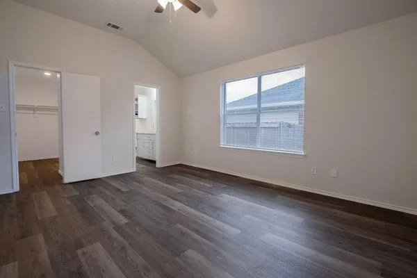 a bathroom with a granite countertop sink toilet and a bathtub