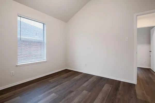 a view of a small space with wooden floor