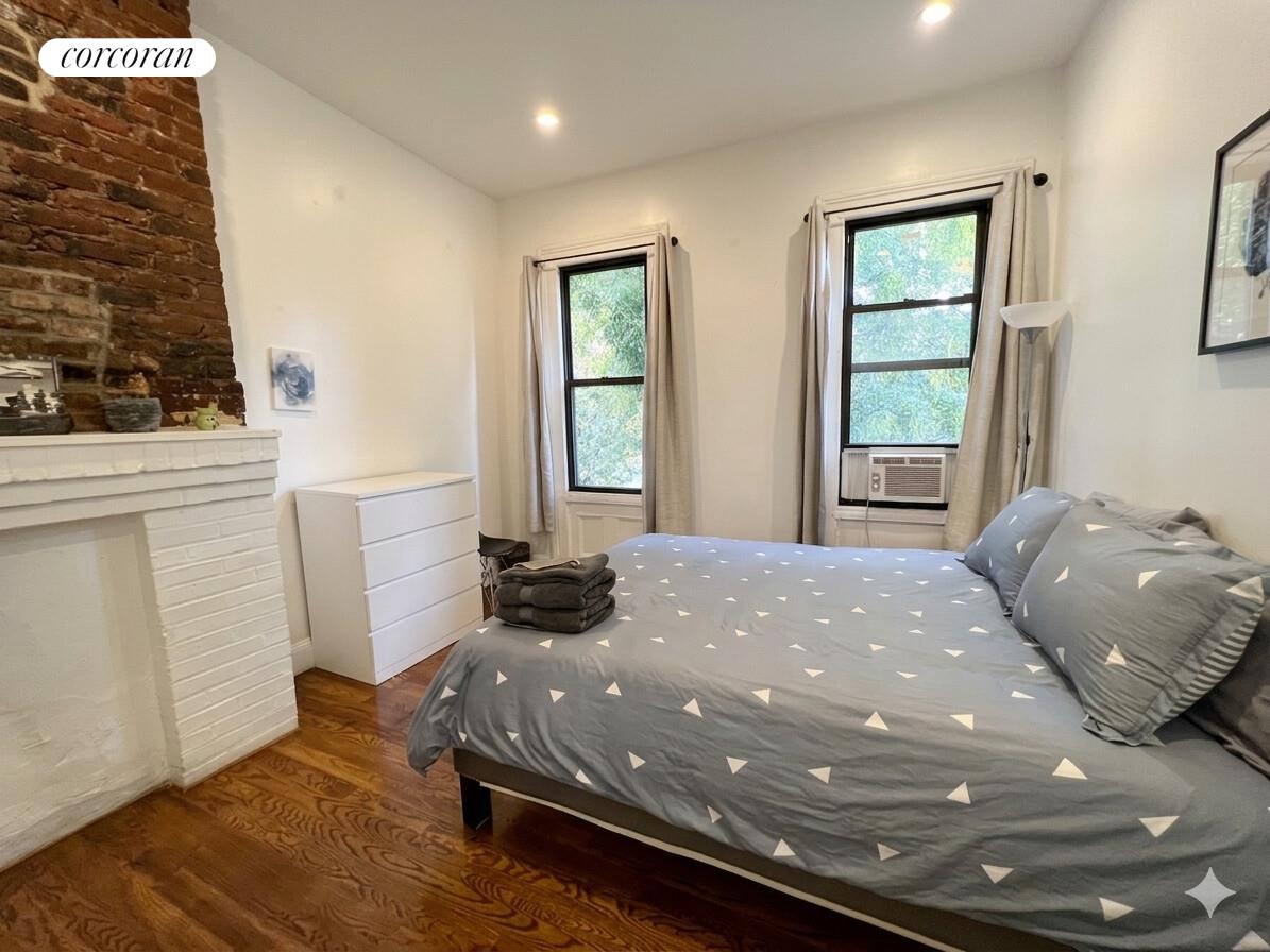 487 Hart Street Brooklyn, NY 11221 - Photo 12 of 19 a view of a livingroom with furniture and window