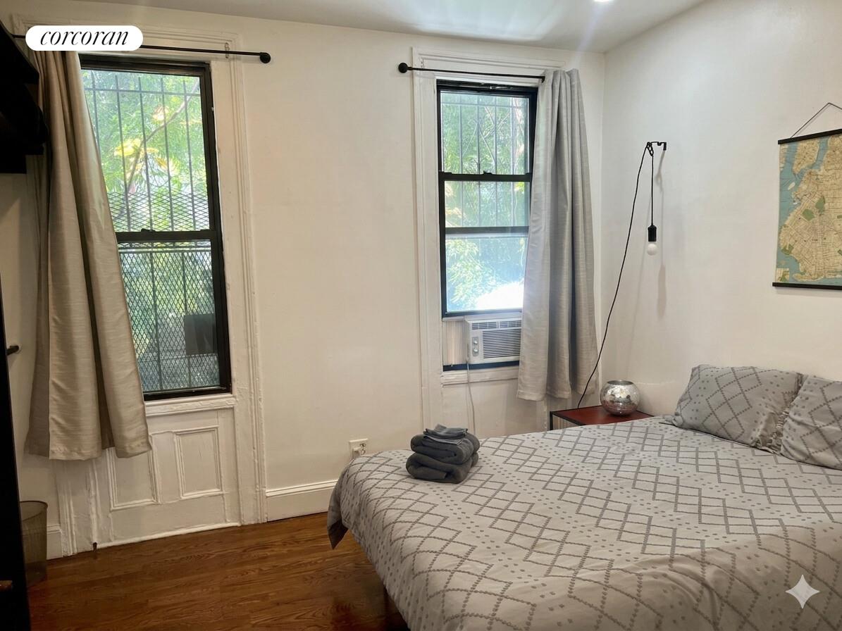 487 Hart Street Brooklyn, NY 11221 - Photo 17 of 19 a bedroom with a bed and a window