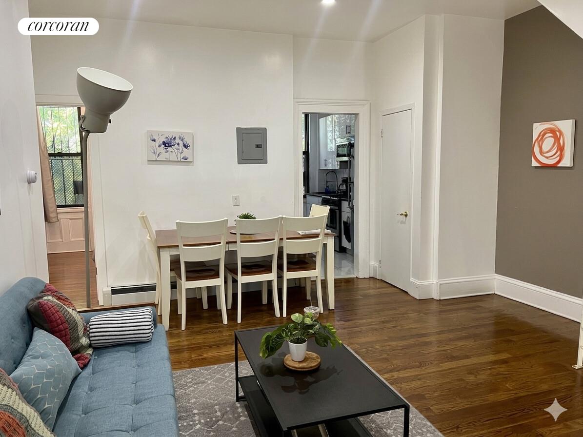 487 Hart Street Brooklyn, NY 11221 - Photo 3 of 19 a living room with furniture and wooden floor