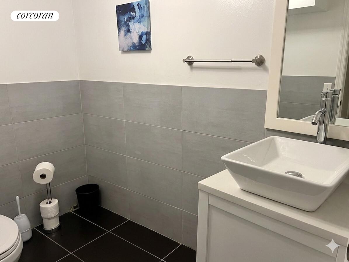 487 Hart Street Brooklyn, NY 11221 - Photo 5 of 19 a bathroom with a sink and a toilet