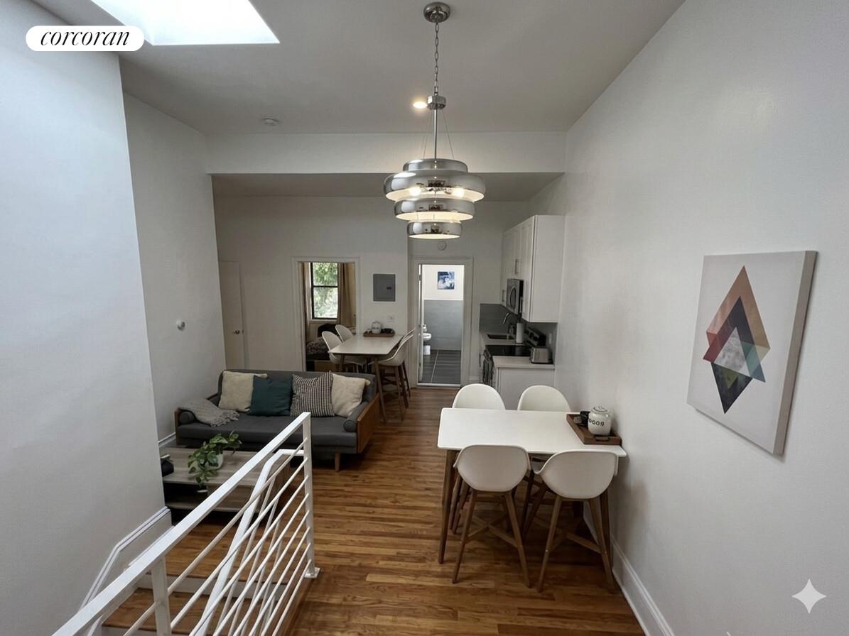 487 Hart Street Brooklyn, NY 11221 - Photo 6 of 19 a view of a dining room with furniture and wooden floor
