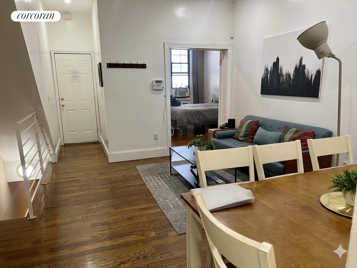 487 Hart Street Brooklyn, NY 11221 - Photo 8 of 19 a living room with furniture and wooden floor