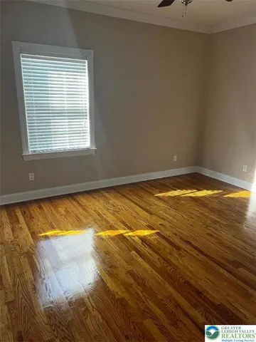 a view of an empty room and window